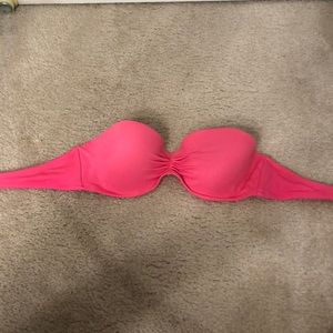 Hot pink strapless swim suit.